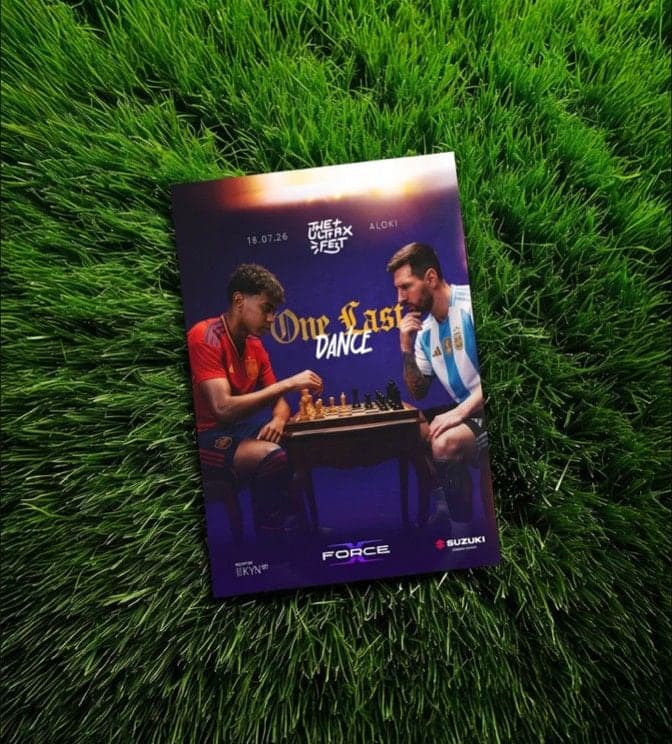 Printed poster on grass: two footballers facing off over chess