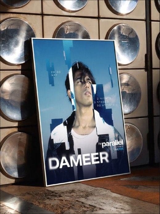 Poster of the artist Dameer, propped against a wall of speakers